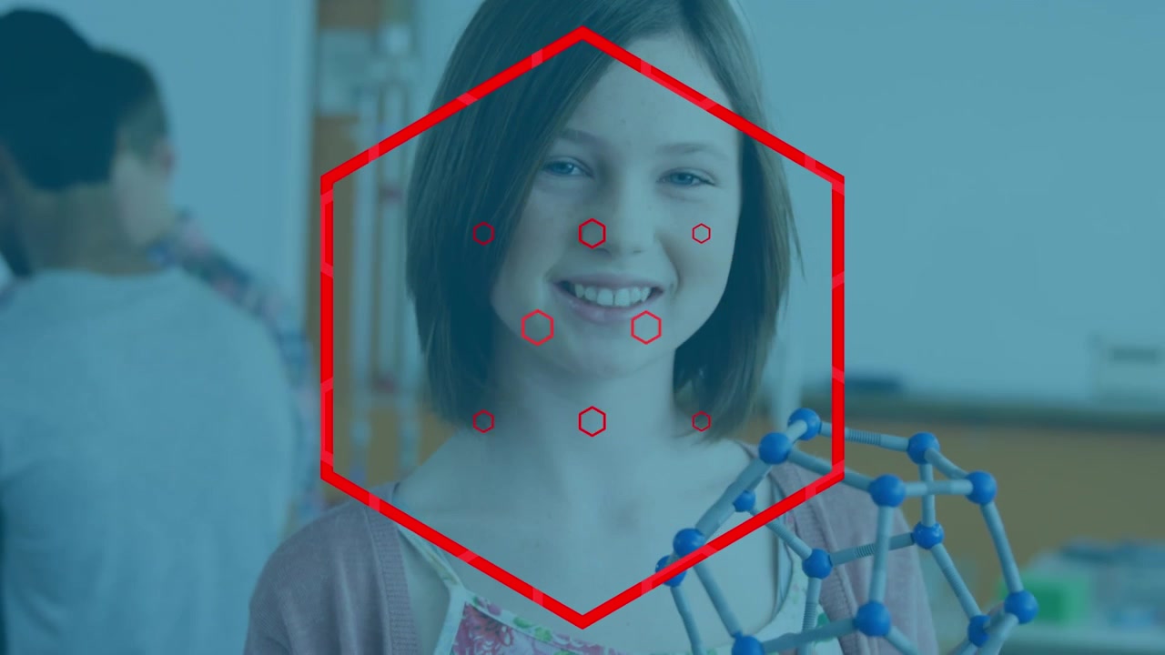Young Student Holding Molecular Model in Science Classroom