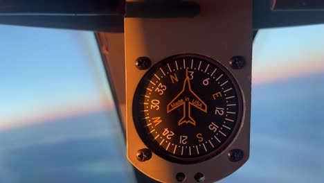 close view of the compass of a modern jet enlightened by the warm light of the sun during dawn