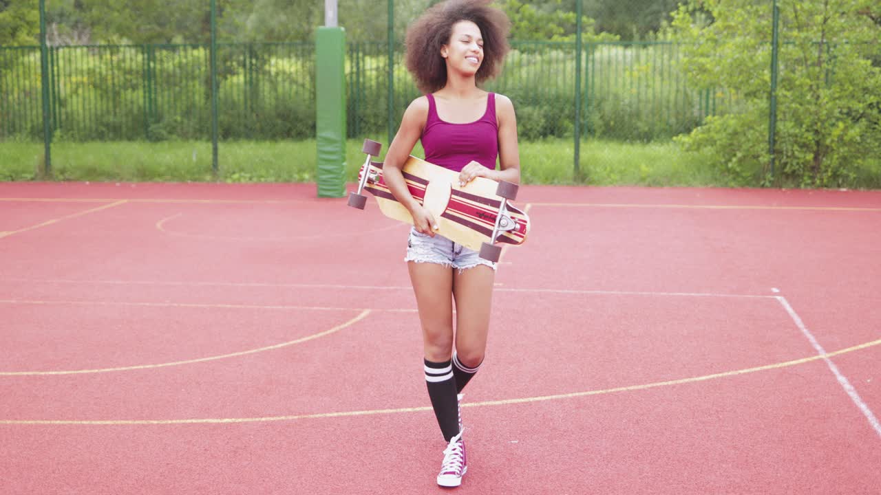 Sporty woman with longboard