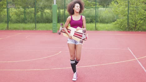 sporty woman with longboard