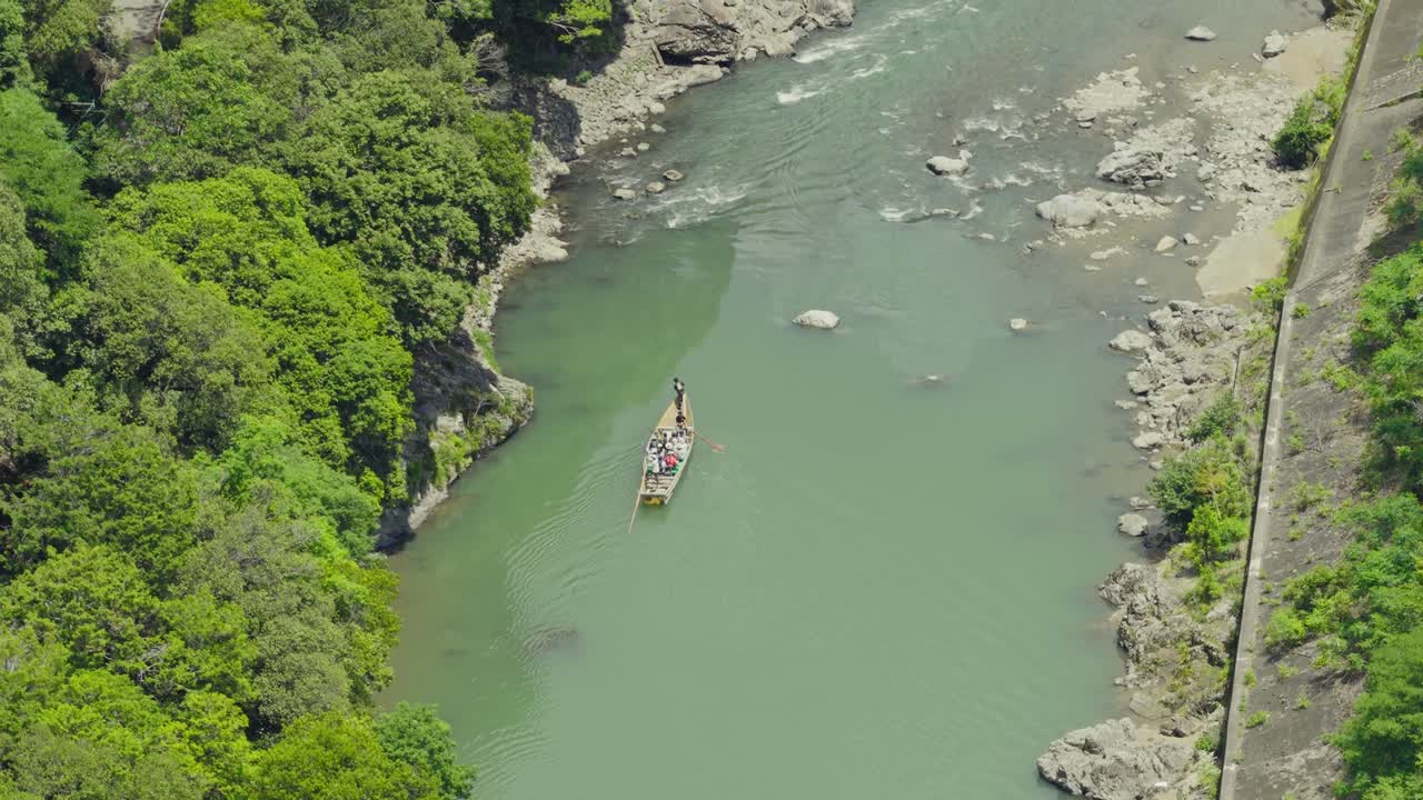 Aerial drone Fly Above Hozugawa River Boat Ride, Kyoto Japan famous journey destination