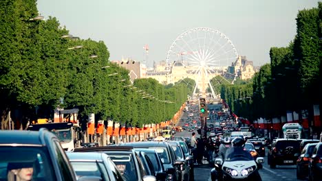 timelapse of champs elysees avenue traffic in paris at france with view of wheel at concorde