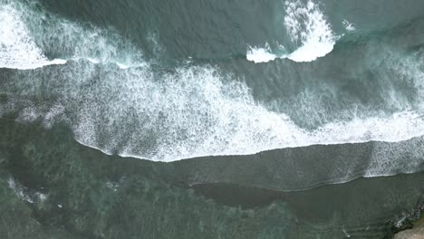 drone fly over sea waves on the beach