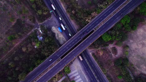 nagpur outer ring road with trees and vehicles at jamtha, nagpur, maharashtra, india. day time, push back, moving up, drone shot, 4k.