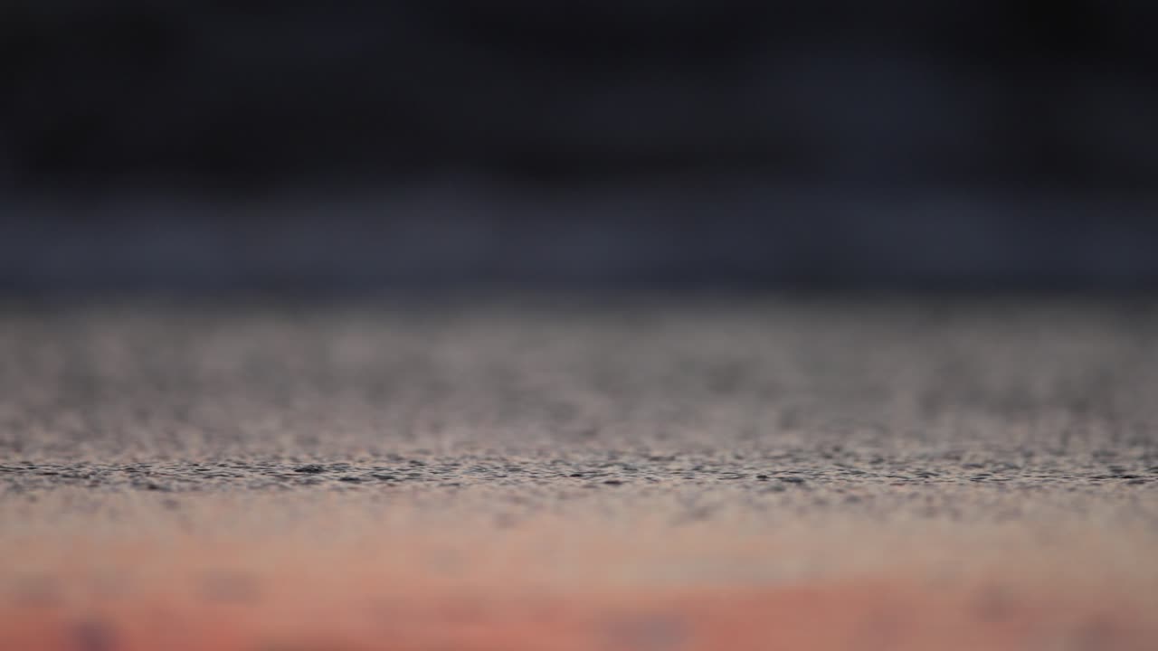 Riflessi sulla spiaggia al tramonto