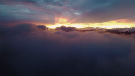 beautiful sunset cloudscape with rays of sunlight through dark cloud, 4k drone