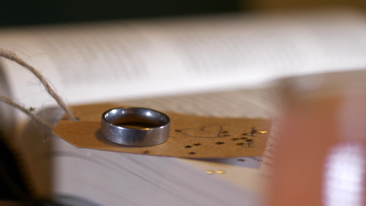 close up sliding pan shot of partners handwritten message note to loved one, valentines day