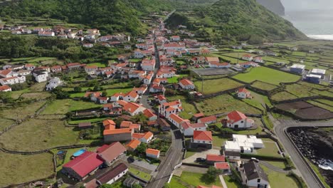 panoramic view of fajã grande coastal town at flores island azores - drone shot