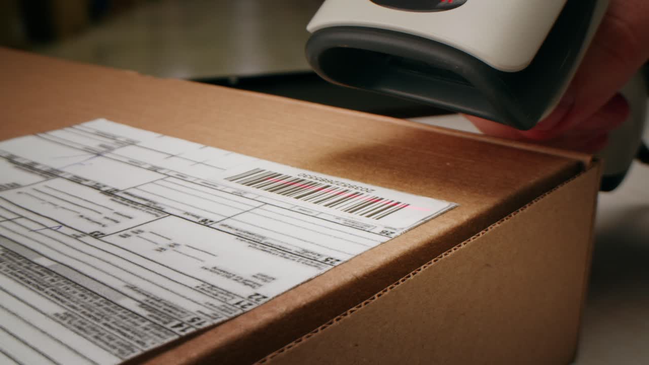 Scanner scan delivery box in storage, E-commerce shop, man packing goods and clothes second hand delivery market, courier Packaging and Shipping Workspace with Supplies and Technology, online sales.