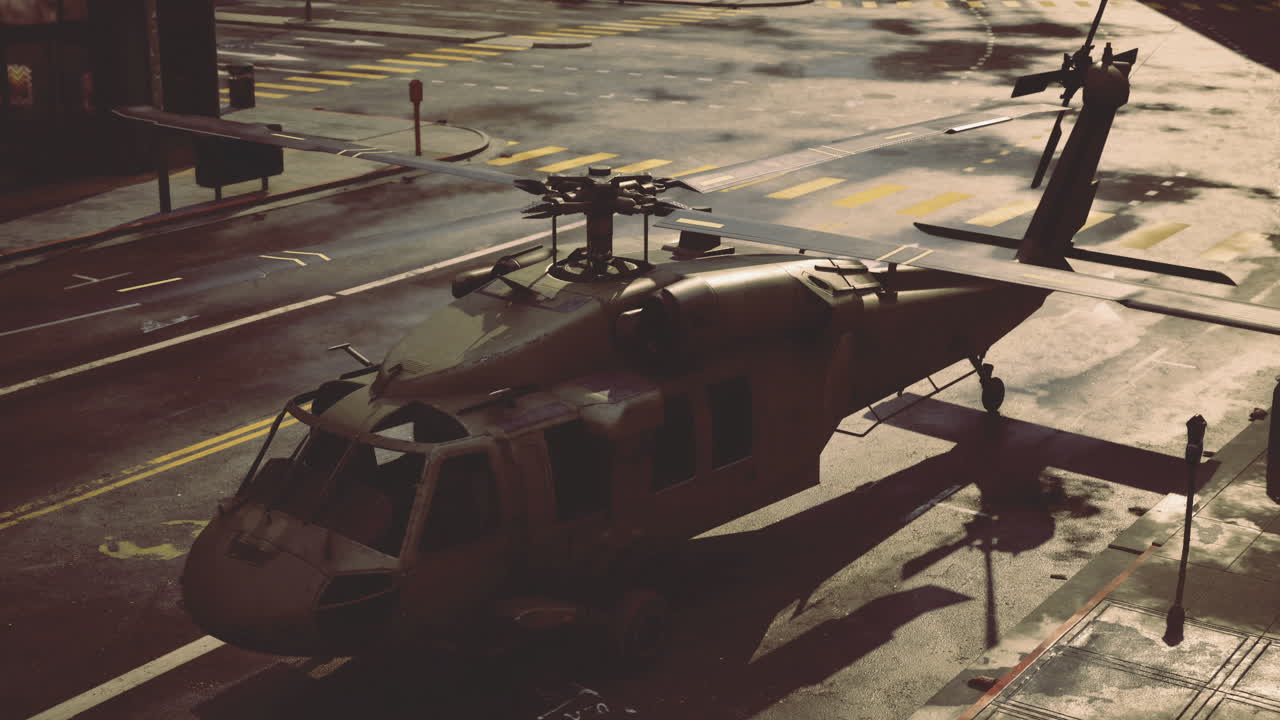 Military helicopter landing in urban environment during twilight