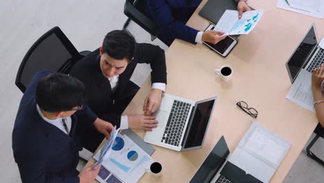 Business-people-group-meeting-shot-from-top-view