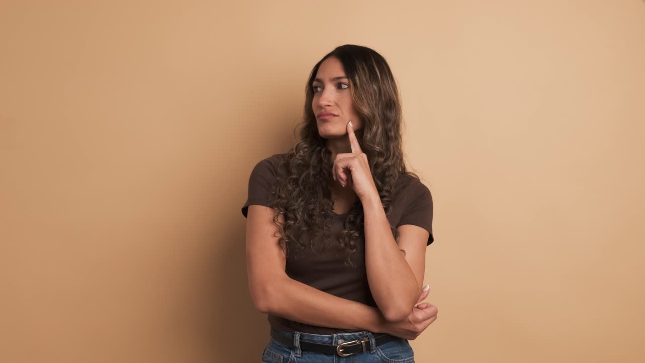 Pensive hispanic woman unsure about a decision