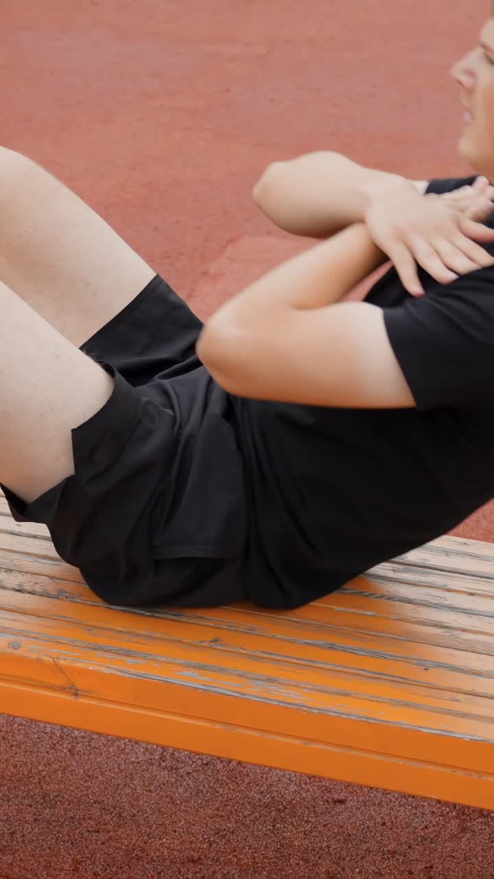 Man exercises outdoors, showcasing athletic endurance and strength, vertical