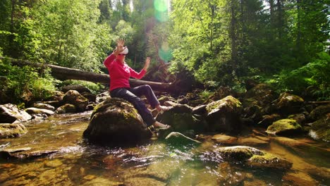 woman wearing vr headset exploring a forest stream