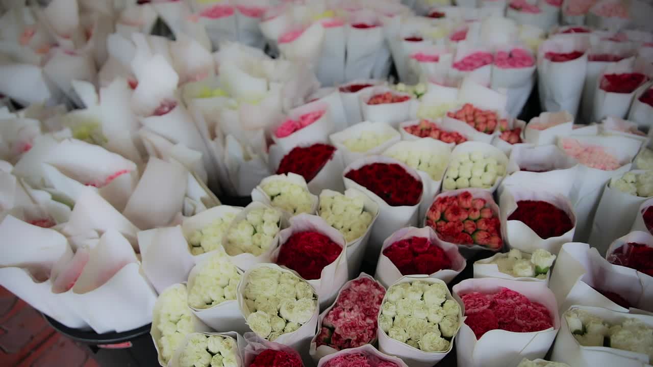 Bouquet's of Roses Wrapped at a Flower Market in Bangkok, Thailand