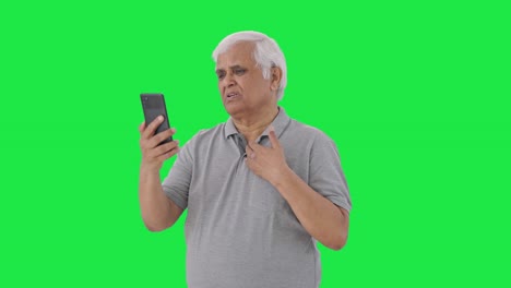 Indian-old-man-talking-on-video-call-Green-screen