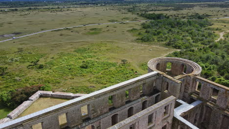 drone flying over the historic borgholm castle on the lush field in oland, sweden - aerial