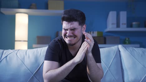young man with anxiety disorder crying thoughtfully.