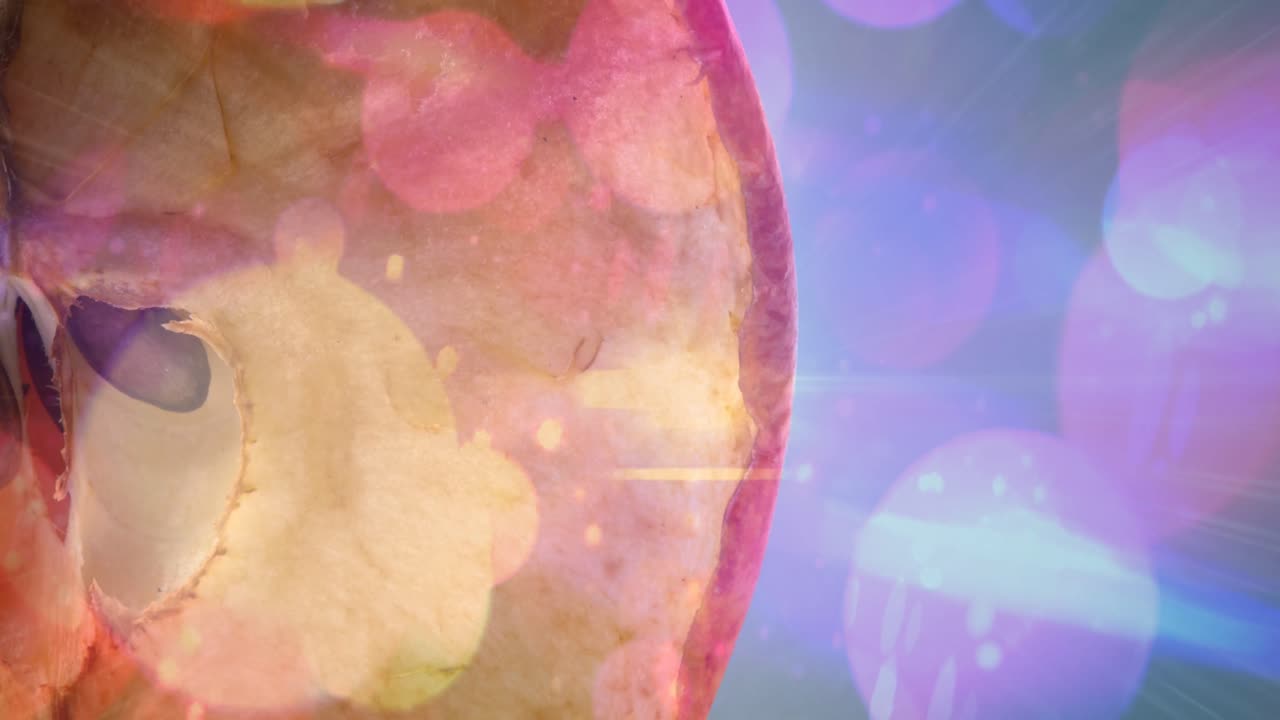 animación de puntos de luz sobre la manzana