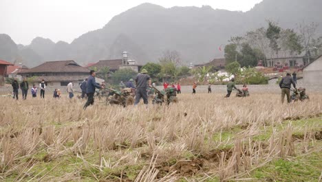 farmers are harvesting the land as a ritual of the cultural activities in the long tong festival, held in bac son town, lang son province, vietnam