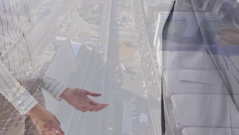 animation of cityscape over caucasian business people in office