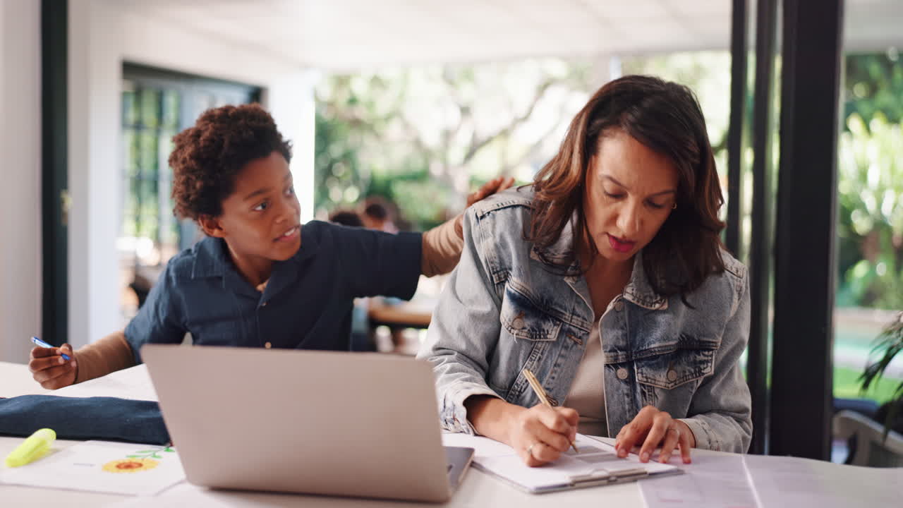 Mother and Son Working at Home Together
