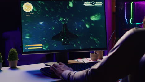 Man-using-gaming-keyboard-to-fly-spaceship-in-SF-videogame,-close-up-on-computer-screen