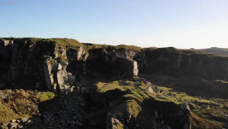 Aerial-Dolly-Forward-Over-Dramatic-Granite-Rocks-At-Foggintor-Quarry