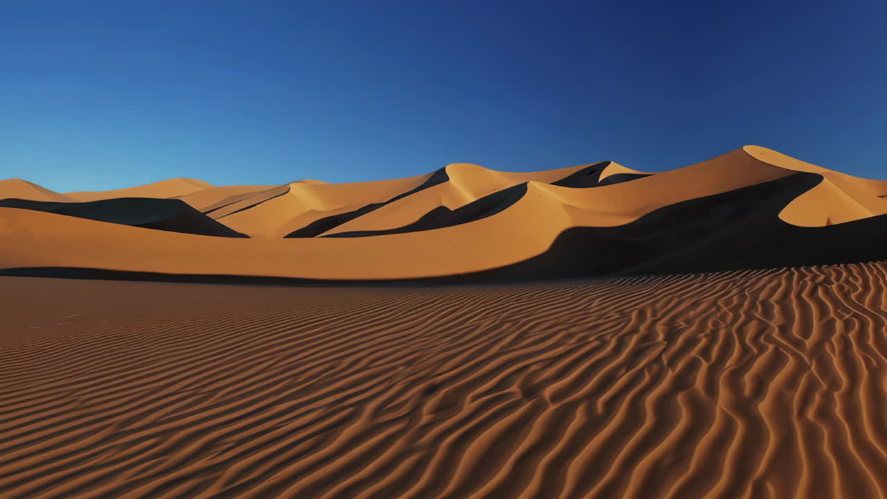 Vast Desert Landscape with Rolling Sand Dunes and Blue Sky