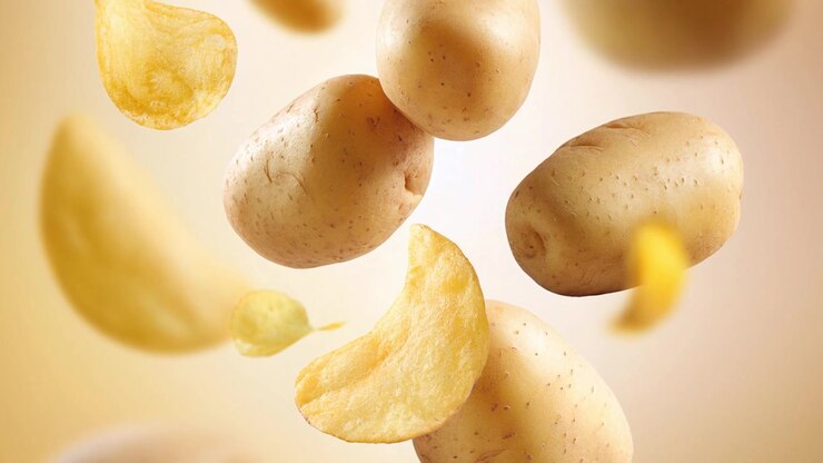 Levitating Fresh Potatoes and Crispy Potato Chips in Motion