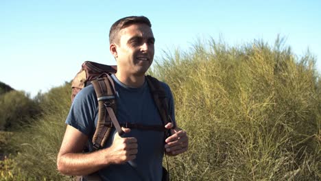 Relaxed-middle-aged-man-wearing-camping-backpack