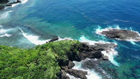 rocky coast with foamy waves near baras, catanduanes province, philippines