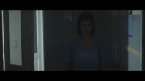 a girl runs through strange corridors of abandoned hospital