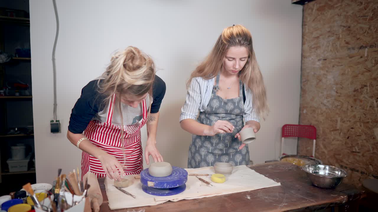 Two Women Creating Pottery