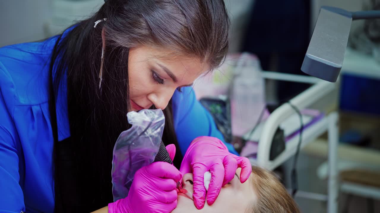 Permanent make up at beauty salon. Close up view of procedure permanent lips makeup