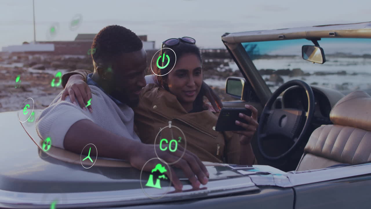In animation, couple driving convertible with eco-friendly symbols surrounding them
