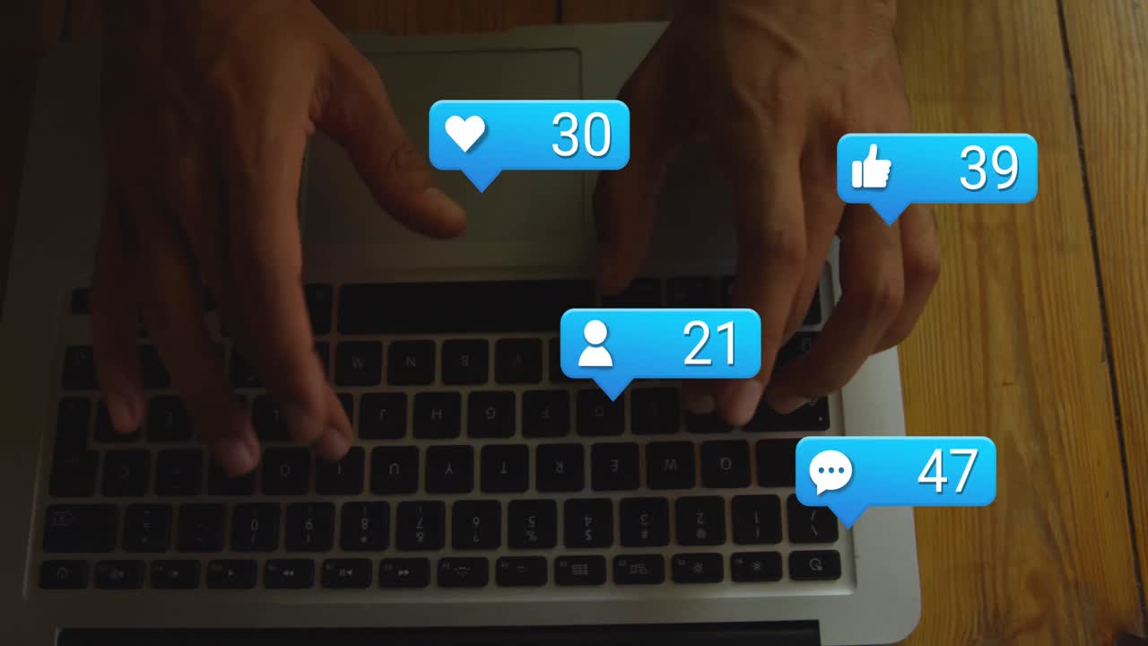 Animation of numbers and icons in message boxes, cropped hands of biracial man using laptop