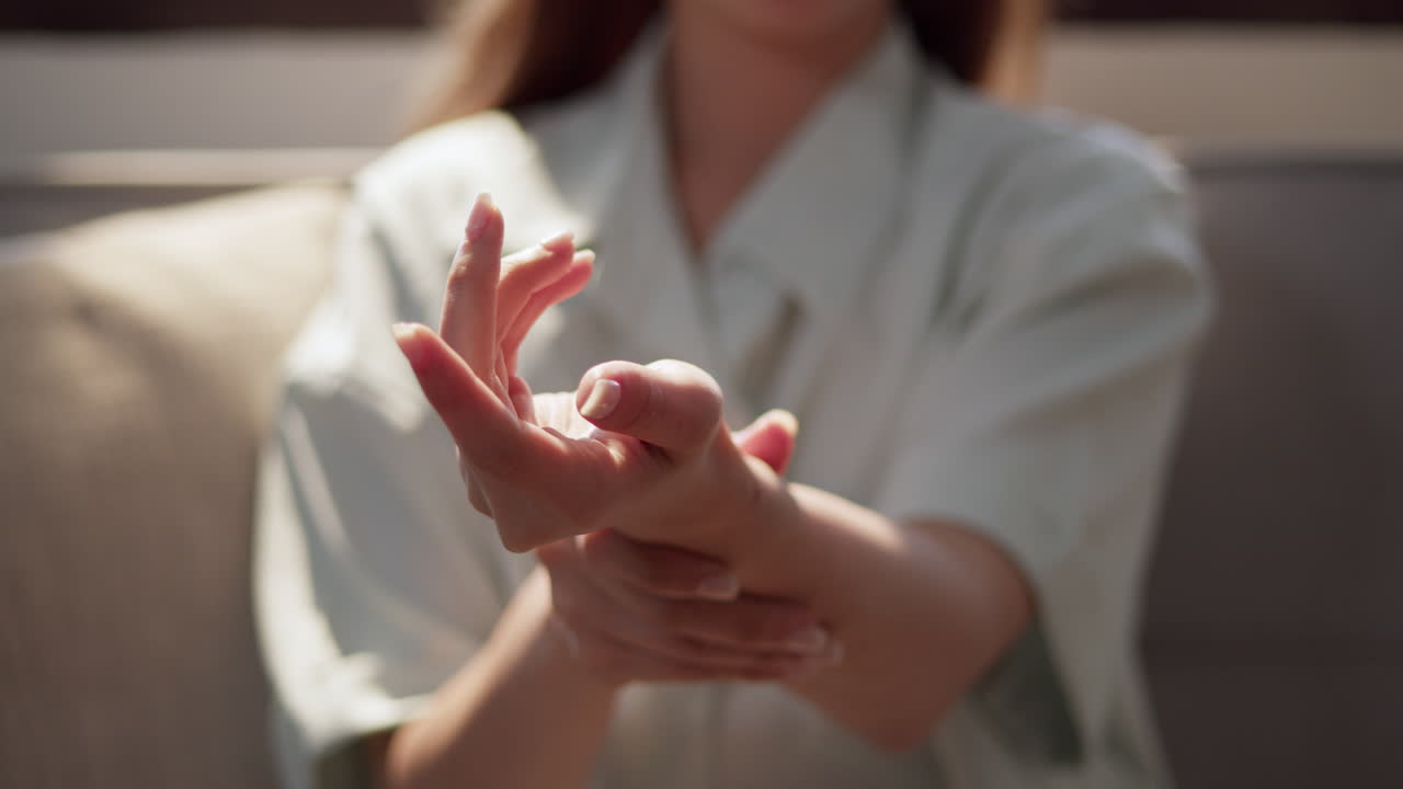 Close up of an Asian woman's hand showing the correct way of Thai massage