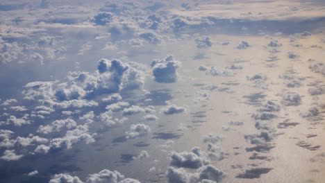 Cirrocumulus-clouds-from-above-over-the-vast-atlantic-ocean-on-golden-hour-on-a-scenic-mood