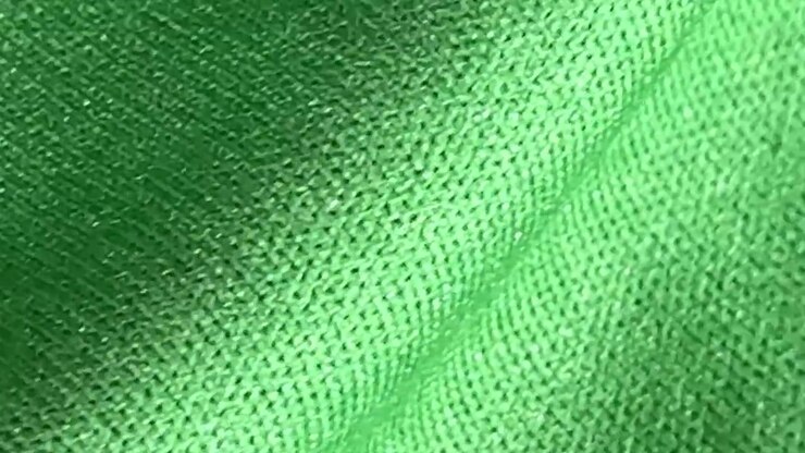 Primo Piano della Trama di Tessuto a Maglia Verde
