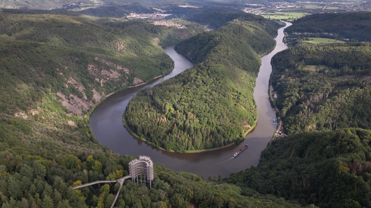 Treetop trail Saarschleife, Saar river, and panorama look out over the valley landscape. Aerial drone video.
