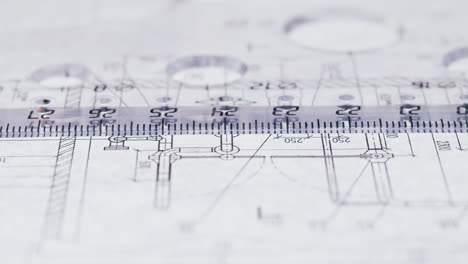 close-up of architectural blueprints with a ruler