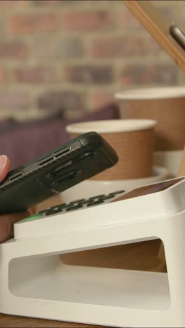 close up of contactless phone payment 01