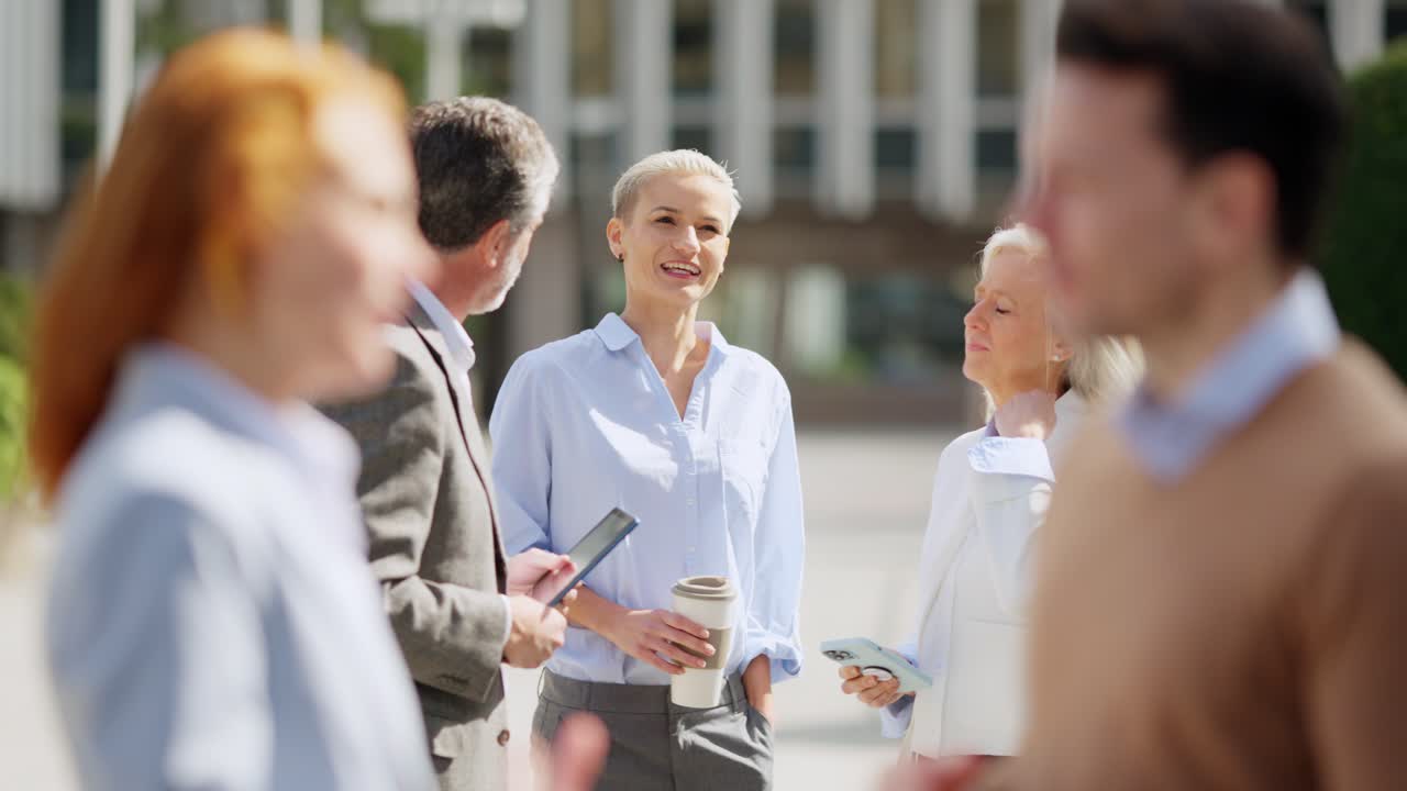 Business professionals discussing outdoors