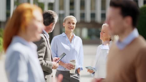 business professionals discussing outdoors