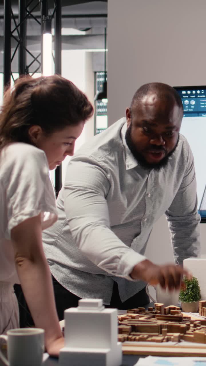 Vertical Video Close up of real estate engineers planning residential project layout