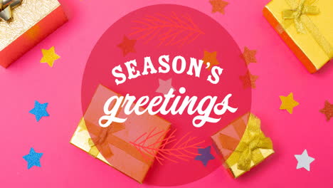 animation of seasons greetings christmas text over christmas decorations on pink background