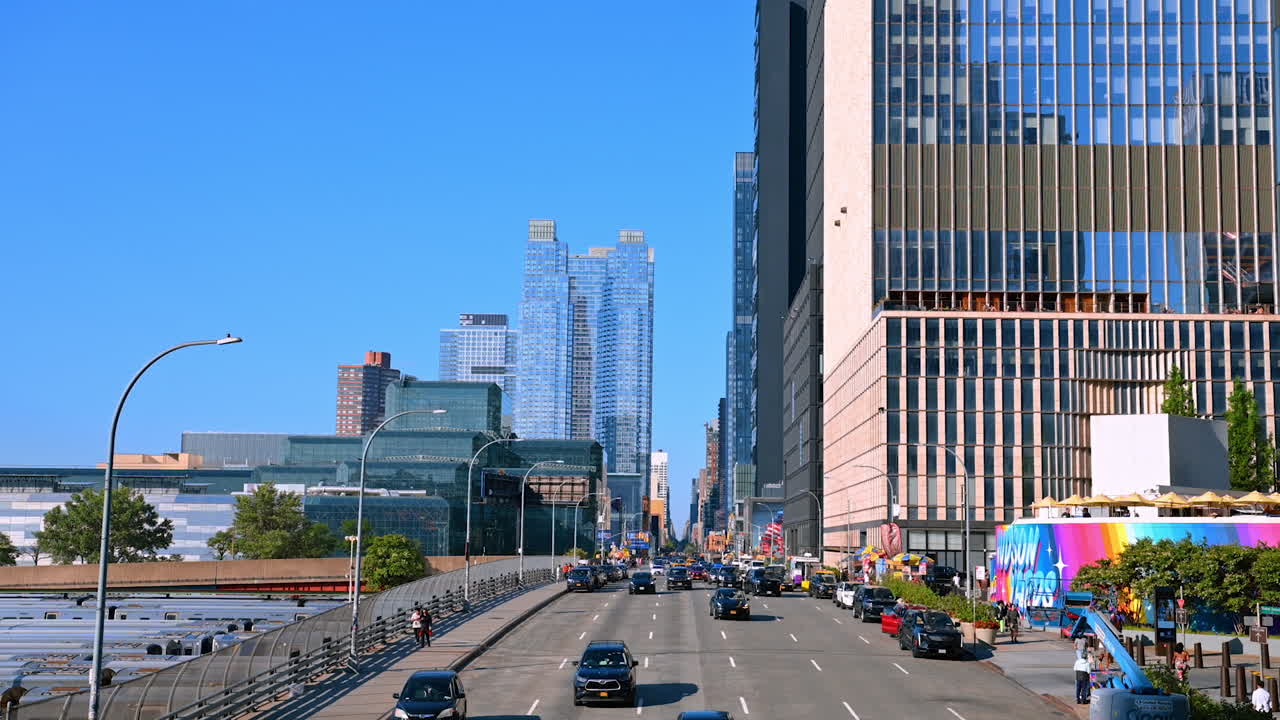 New York, USA, 4 August 2025: Traffic and skyscrapers in Hudson Yards Manhattan view. New York City street traffic and glass towers rising in Hudson Yards, Manhattan