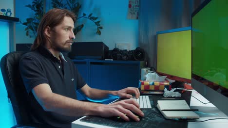 freelance worker using computer and typing on keyboard with green screen