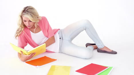 pretty young student studying on floor